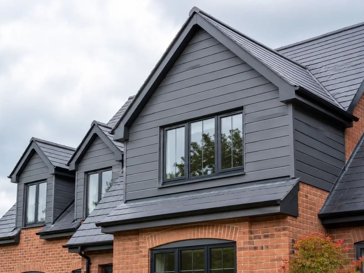Grey uPVC shiplap cladding on a gable end
