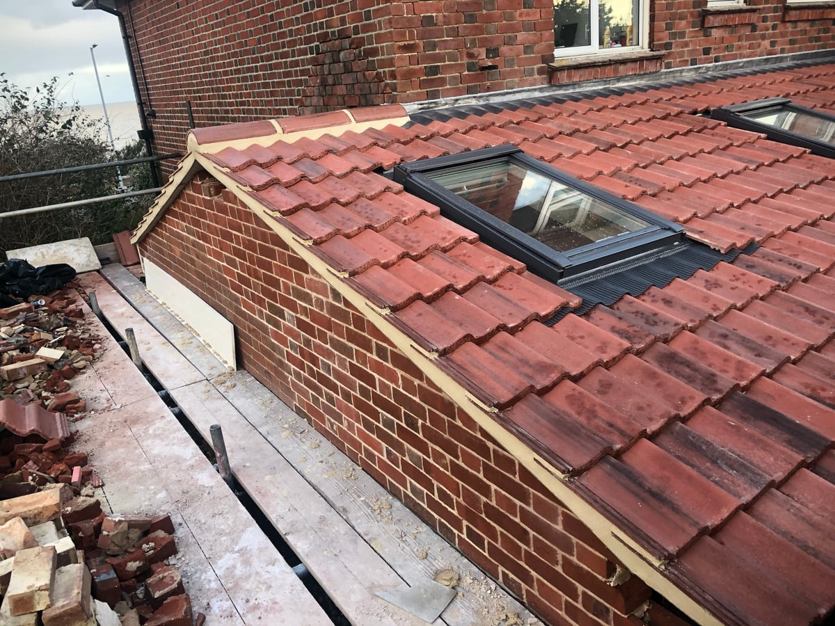 A new tiled lean-to roof with a rooflight