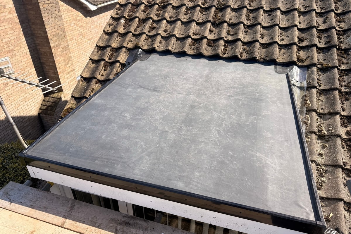 A new EPDM rubber flat roof on a single-storey extension