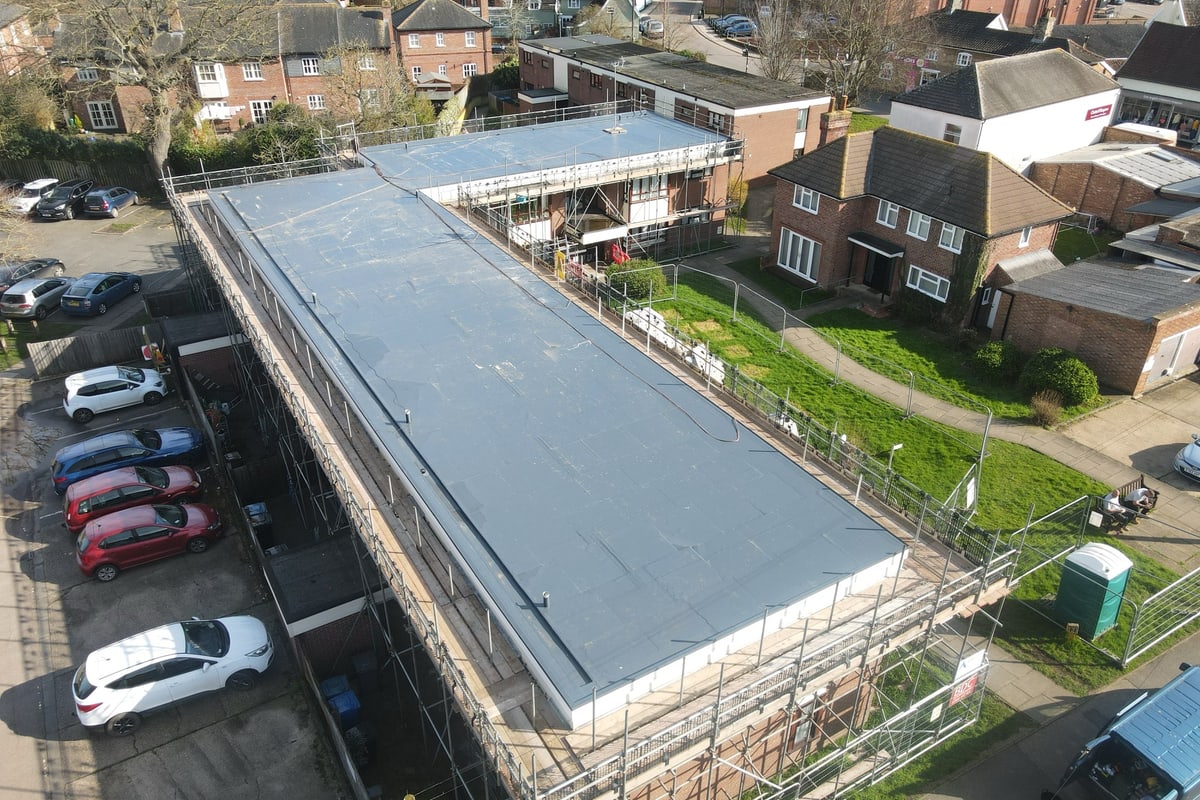 A large single ply membrane roof on a commercial building