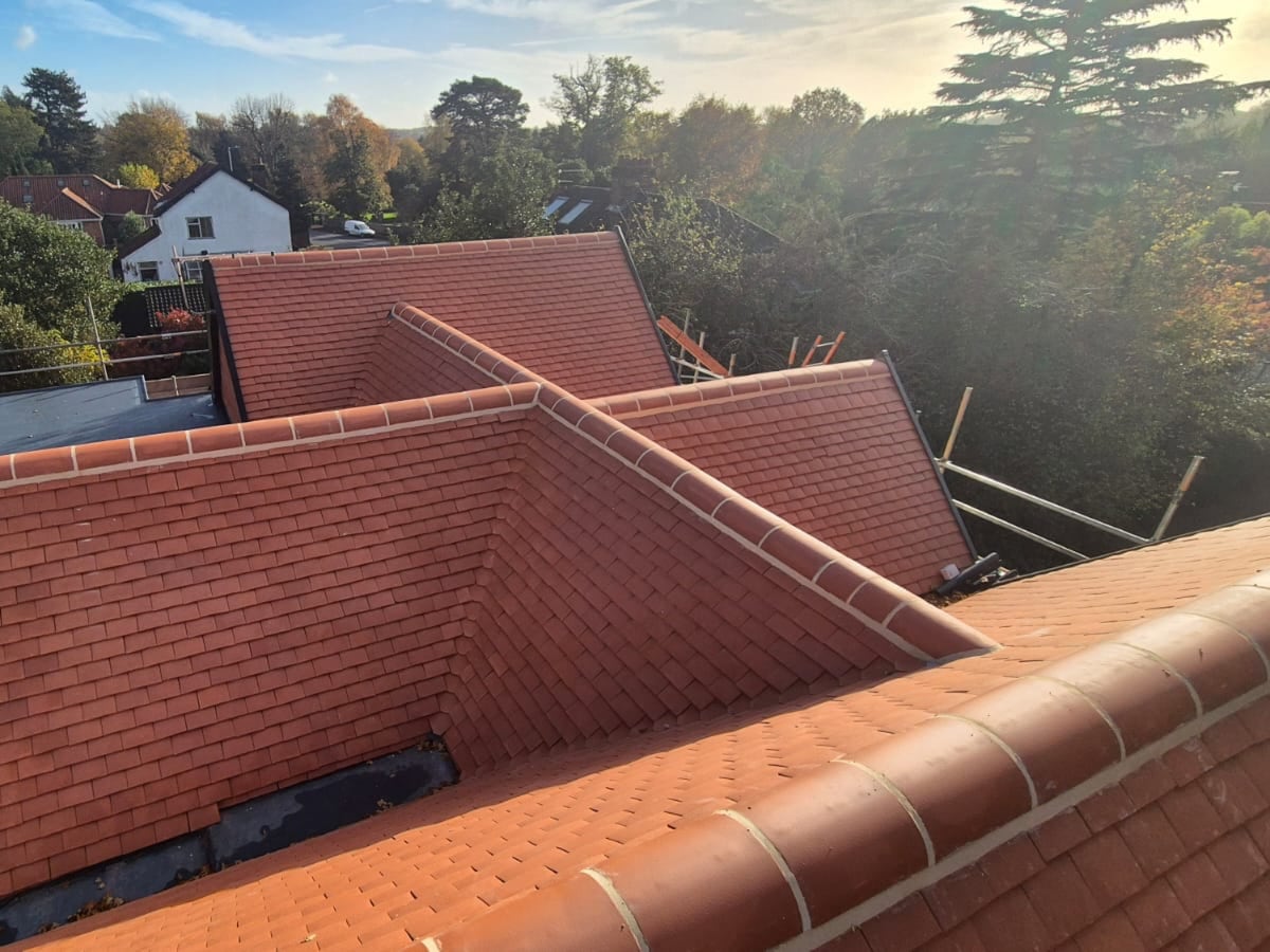 New red clay pantiles on a dormer roof