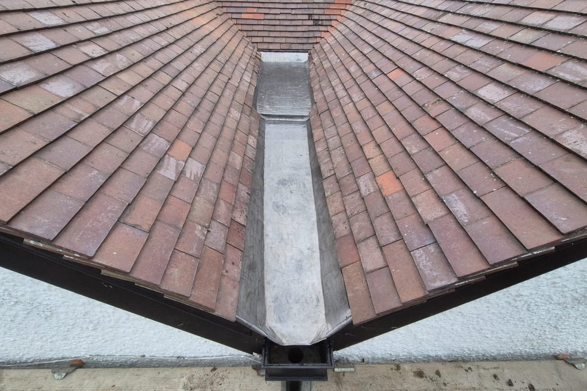 A new lead valley between two tiled roof slopes
