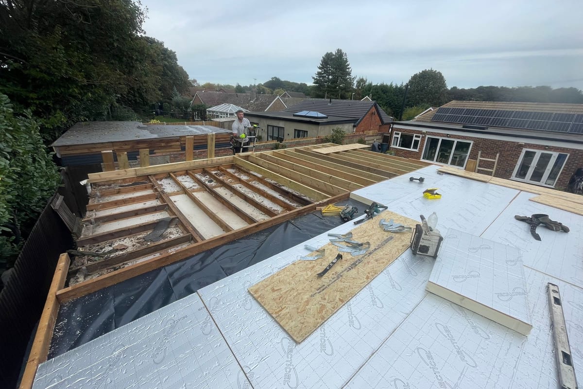 Insulation boards and a new deck going down on a flat roof