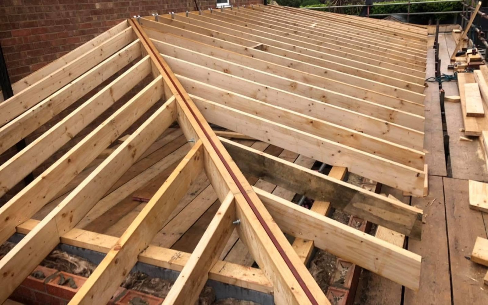 New hipped roof timbers being built by District Roofing