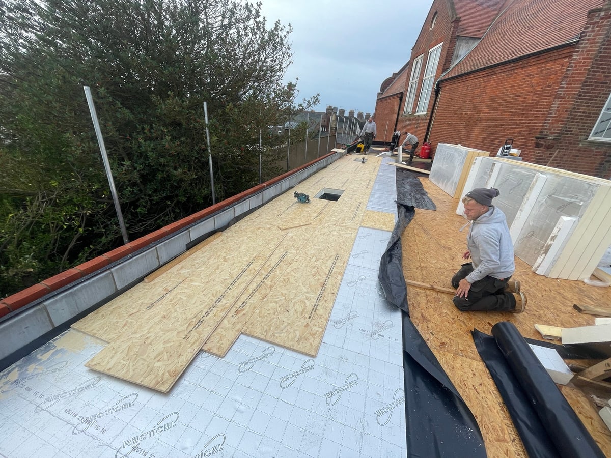 A flat roof part-way through, with the new deck and insulation going down